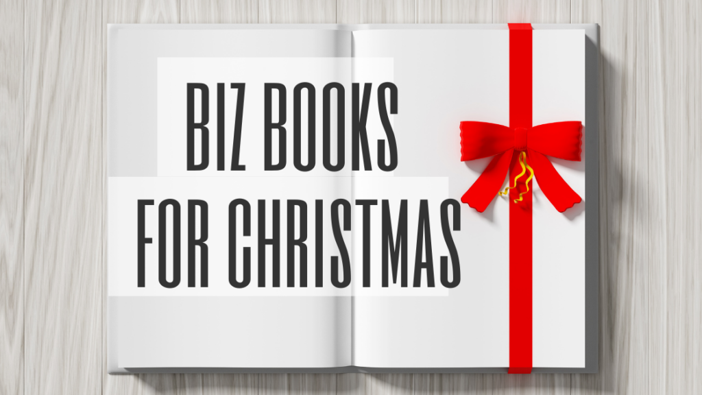 Best business books for Christmas - open book with white pages and a red ribbon